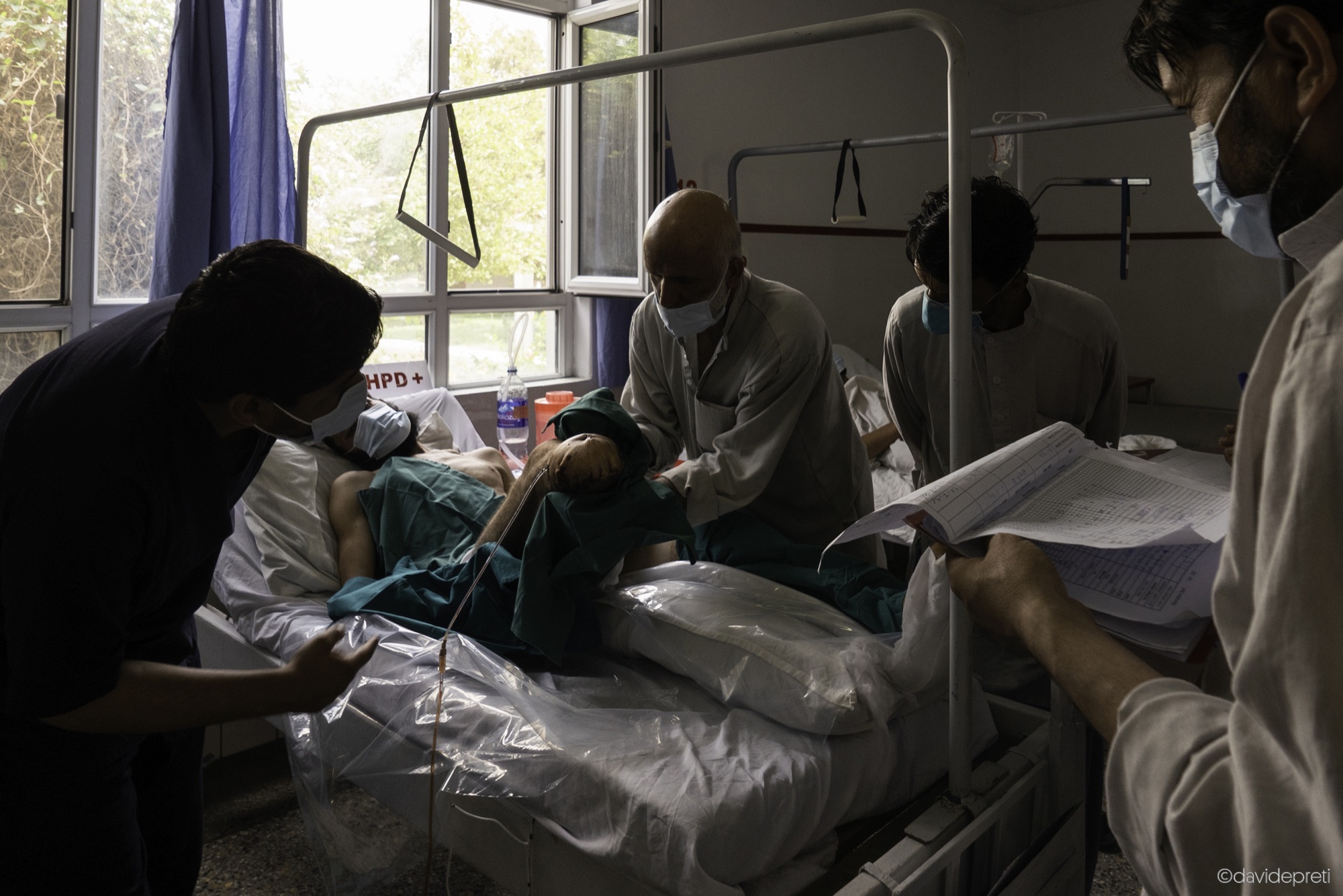Kabul, Afghanistan — July 14, 2021.

Nurses dressing a patient's wounds inside the ward of the EMERGENCY's Surgical Centre for War Victims in Kabul.
