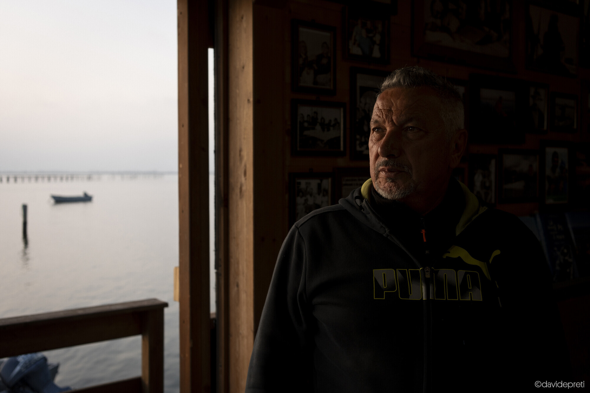 Scardovari Lagoon, Italy — November 7, 2024.

Local fisherman Massimo, known here as the "poet-fisherman," inside his cavana — a traditional wooden stilt house in the Sacca di Scardovari lagoon.
