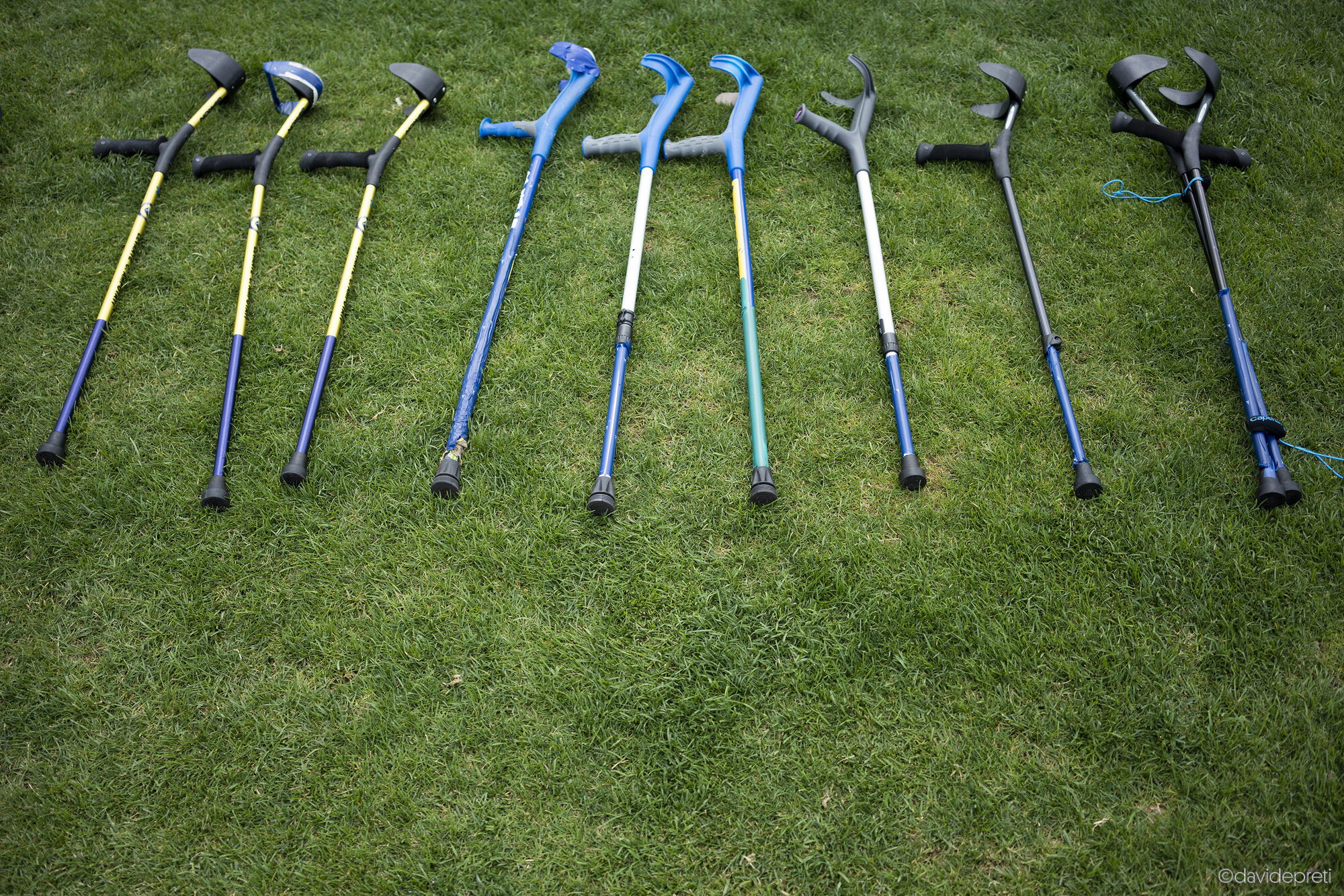 Istanbul, Turkey — October 5, 2022.

Spare crutches resting beside the Italian team's bench during a match at the Amputee Football World Cup.
