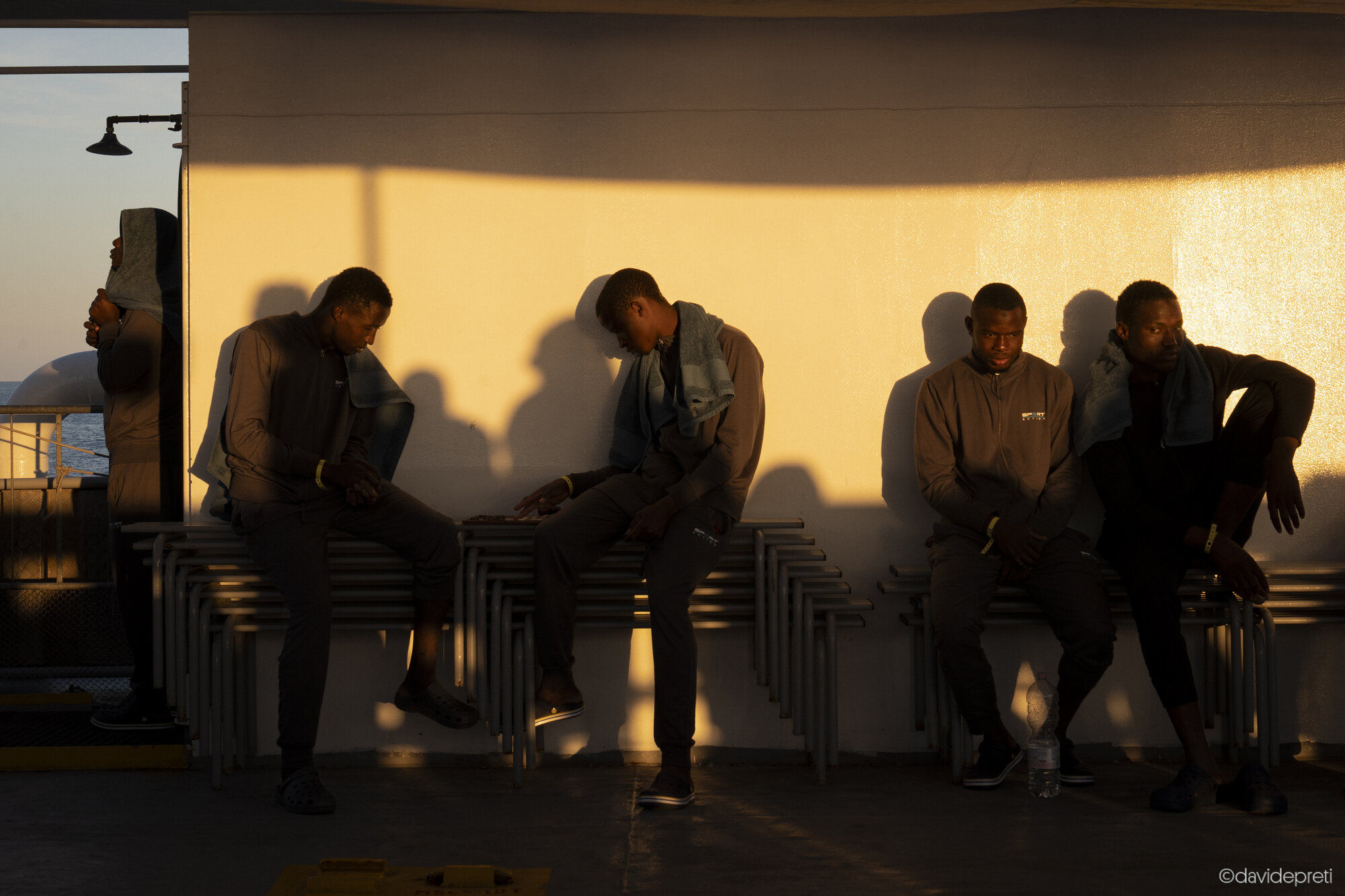 Central Mediterranean Sea — May 5, 2024.

Survivors play chess on the deck of the Life Support during the voyage toward the Place of Safety (POS) assigned by the Italian Navy.
