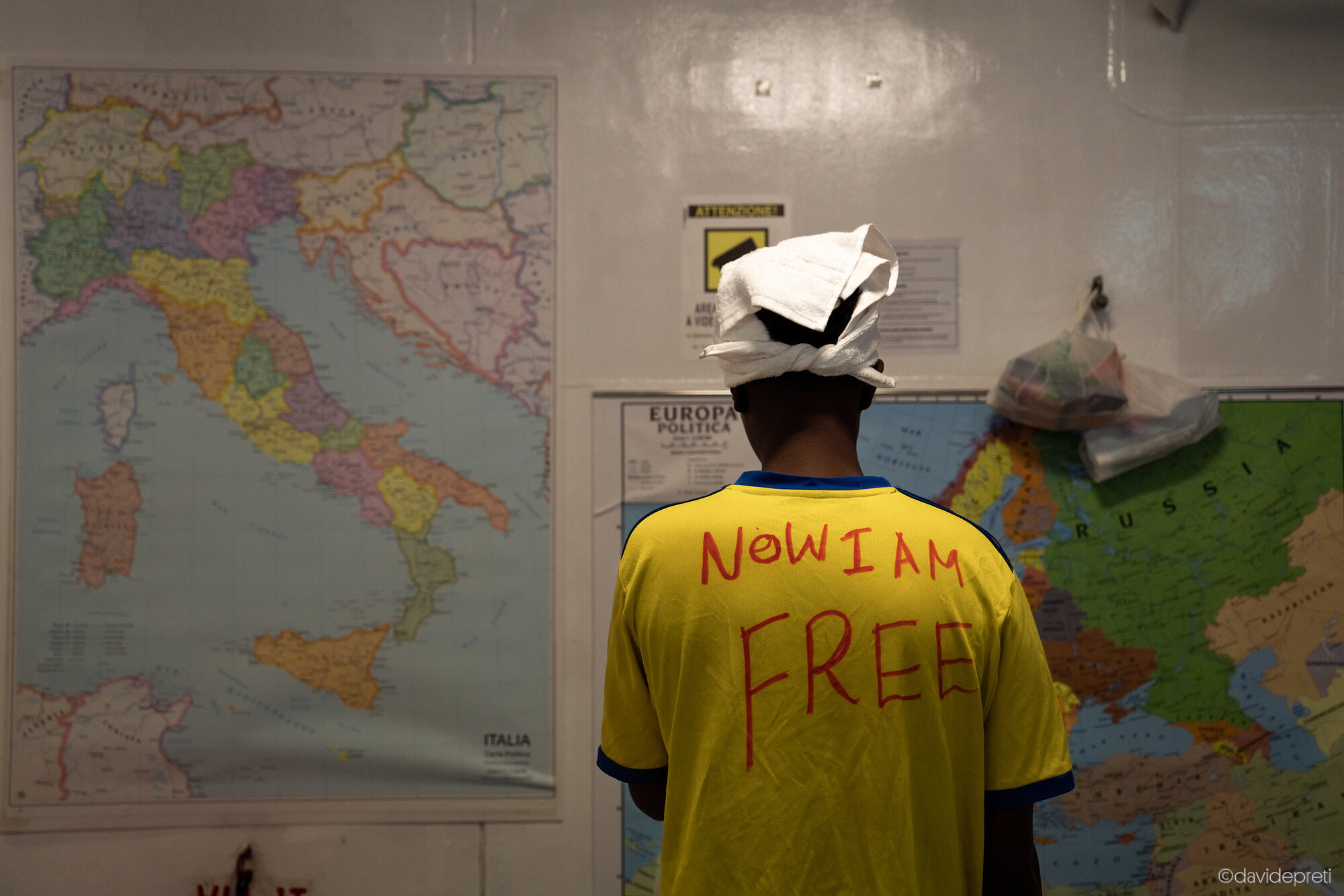 Central Mediterranean Sea — December 21, 2022.

S. is 16 years old. He is Somali. In 2020, he left Mogadishu, crossed Ethiopia, reached Khartoum and then headed for Libya. He wanted to go to England, where he has relatives. He stayed in Libya for two years. Two years in which he was kidnapped, imprisoned, tortured. That is why the day after his arrival he asked for a marker to write on his t-shirt: "Now I'm Free".
