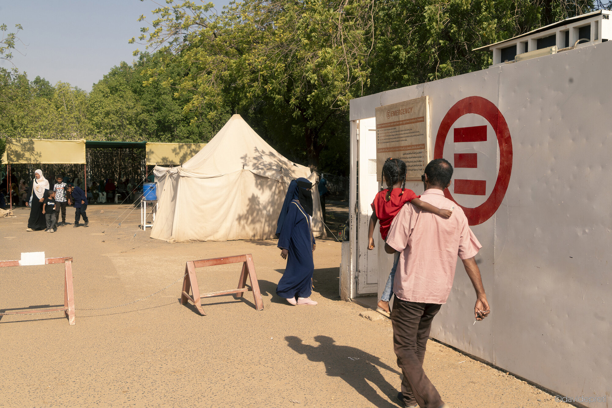 Khartoum, Sudan — November 23, 2025.

Patients enter through the main gates of EMERGENCY's Salam Centre for Cardiac Surgery.
