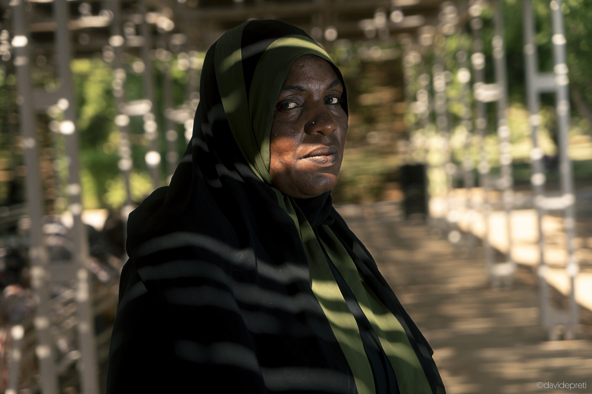 Khartoum, Sudan — November 16, 2025.

M. - 41 yo

She lives in Omdurman and is a mother of five. During the war, RSF paramilitaries killed two of her brothers. In August 2024, she was diagnosed with a severe heart condition. She set out for EMERGENCY's Salam Centre, navigating secondary roads to bypass RSF blockades. "An acquaintance told me about the Salam," she says. "They told me they treat everyone there, for free." She underwent surgery in November.

One month later, the fighting intensified in Soba, the district housing the hospital. The staff began evacuating patients for their safety. M. tried to reach a cousin's house on foot, but she was stopped at a checkpoint after an hour of walking. Despite showing her discharge papers, the militiamen accused her of lying. They tore the surgical dressing from her chest and left her bleeding on the street. They forbade anyone from helping her, calling her the "wife of a traitor." A passerby eventually saved her and helped her reach her cousin's home.

"My children no longer go to school," she says. "After two brothers killed, it is hard to hope for the future."
