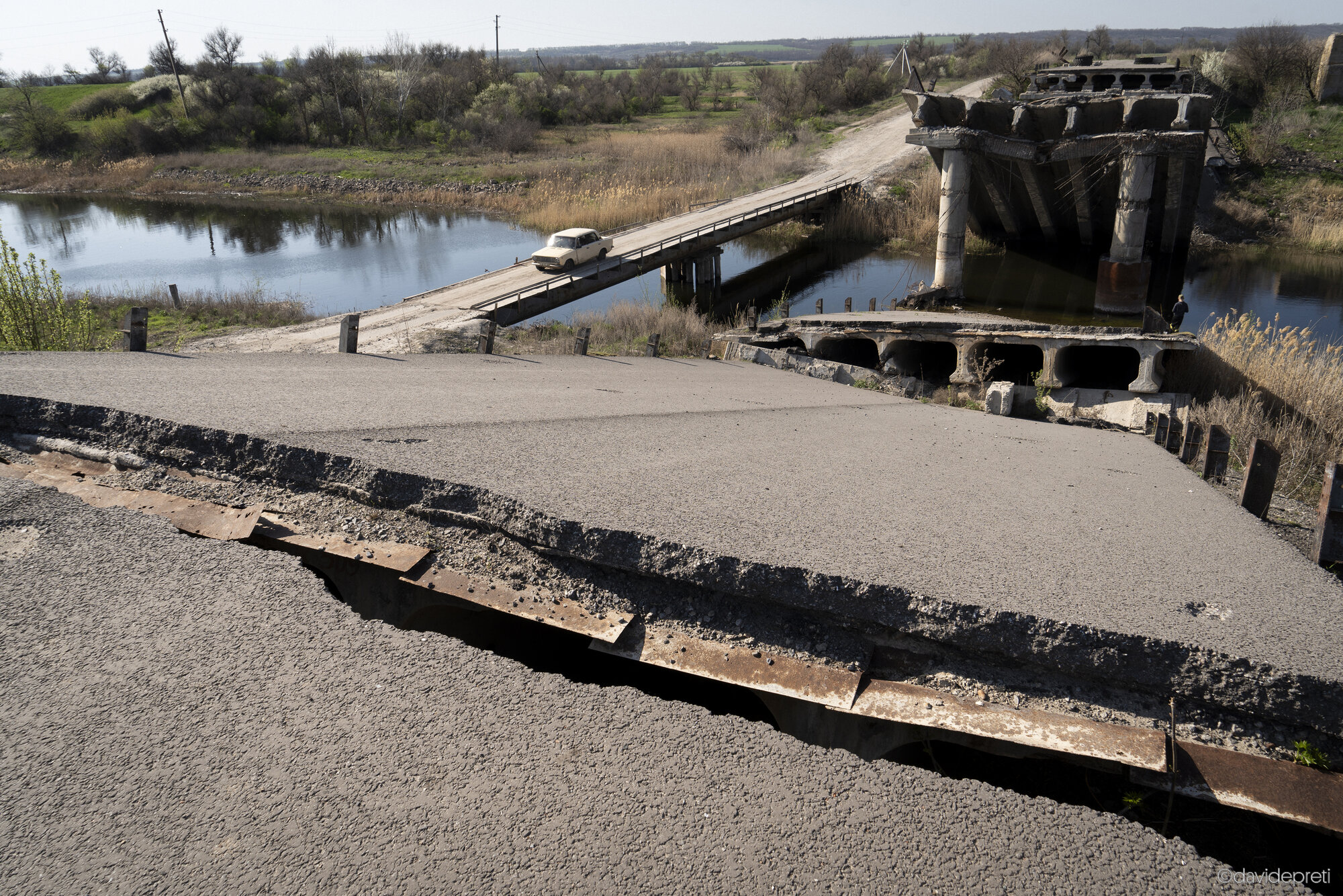 Barvinkove, Ukraine — April 18, 2025.

A classic Trabant car crossing a temporary bridge built after the main crossing was destroyed, connecting the Donetsk and Kharkiv oblasts in rural Ukraine.
