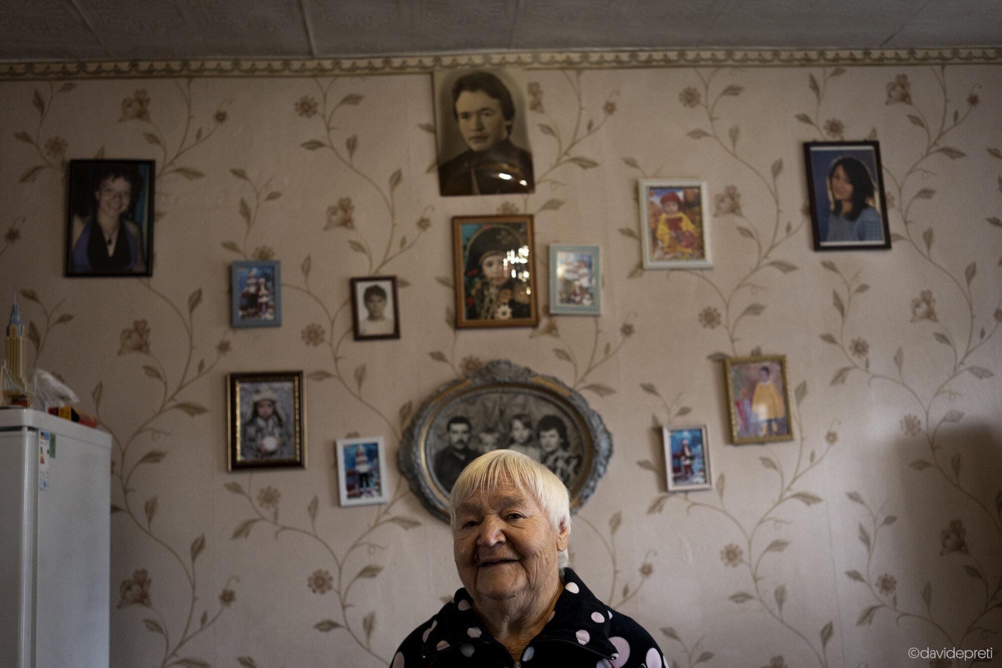 Dmytrokolyne, Ukraine — October 16, 2024.

KATERINA - 87 yo

"I was outside slaughtering chickens when my daughter told me you had arrived. I ran inside to wash up and put on my finest dress.

I'm 87 now, but luckily I don't have any major health issues. I live right across from the clinic EMERGENCY set up, so if I need anything, I go right over. This morning, for instance, I went to get my blood sugar checked.

I live alone, but I have a large family: two children, four grandchildren, and seven great-grandchildren. My son left for Lviv at the beginning of the war and hasn't returned since. My daughter fled to Kharkiv with the grandchildren, but she has come back now and lives nearby. She visits me every day, but for two years I was completely alone in this house. I tended the garden, cleaned, fed the chickens. It was hard, but you know what I missed the most? Talking to people. I know everyone here, from the youngest to the oldest.

Thank you so much for creating this clinic. It's right in front of my house, and it's wonderful! And Anna, the CHW, is fantastic. When she comes over, we sit and chat and spend a good deal of time together.

At 87, I never imagined I'd be chatting with Italians in my garden! I'll be waiting for you next year—I'm always happy to have guests!"
