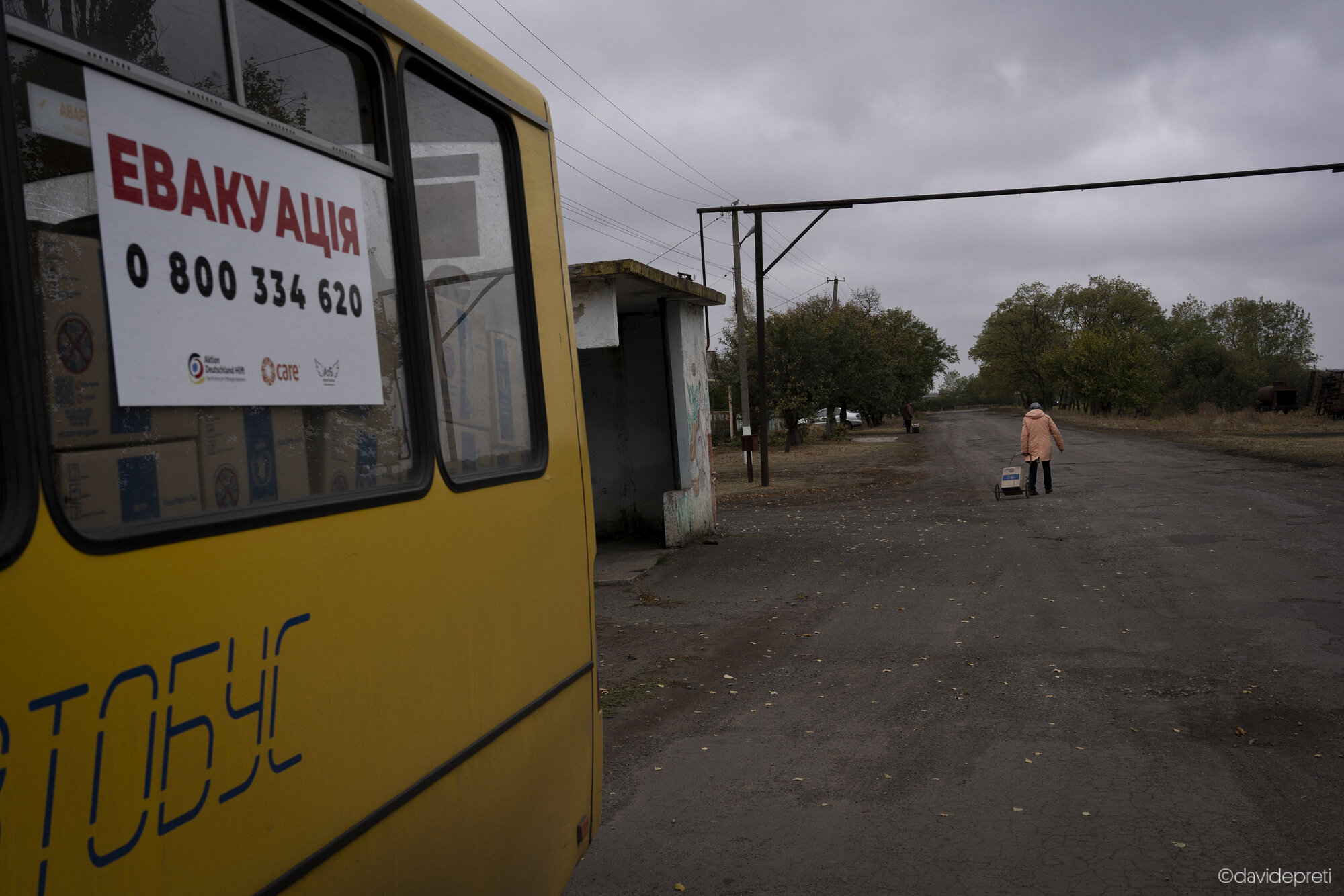 Myrna Dolyna, Ukraine — October 18, 2024.

An elderly woman returning home after collecting a food and hygiene kit provided by the World Food Programme.
