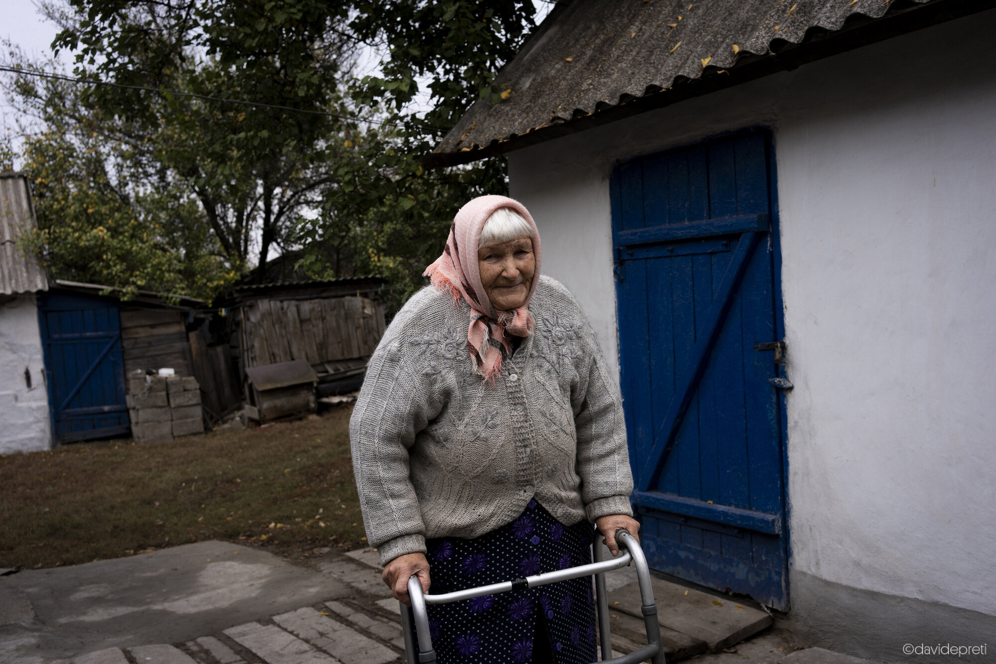 Myrna Dolyna, Ukraine — October 16, 2024.

LUDMILLA - 78 yo

"I feel a bit better today, but when it's cloudy, my bones ache and I have to take my medicine—otherwise the pain keeps me in bed. I'm really glad to have Natalia as my healthcare worker, and she's also my neighbor. I'm not just saying this because she's sitting right next to me, but truly, she's available for anything. I call her and she comes right away to help me.

These services are essential. I hope they continue for a long time, because people like me need care—someone to come visit us, even just to ask how we are."
