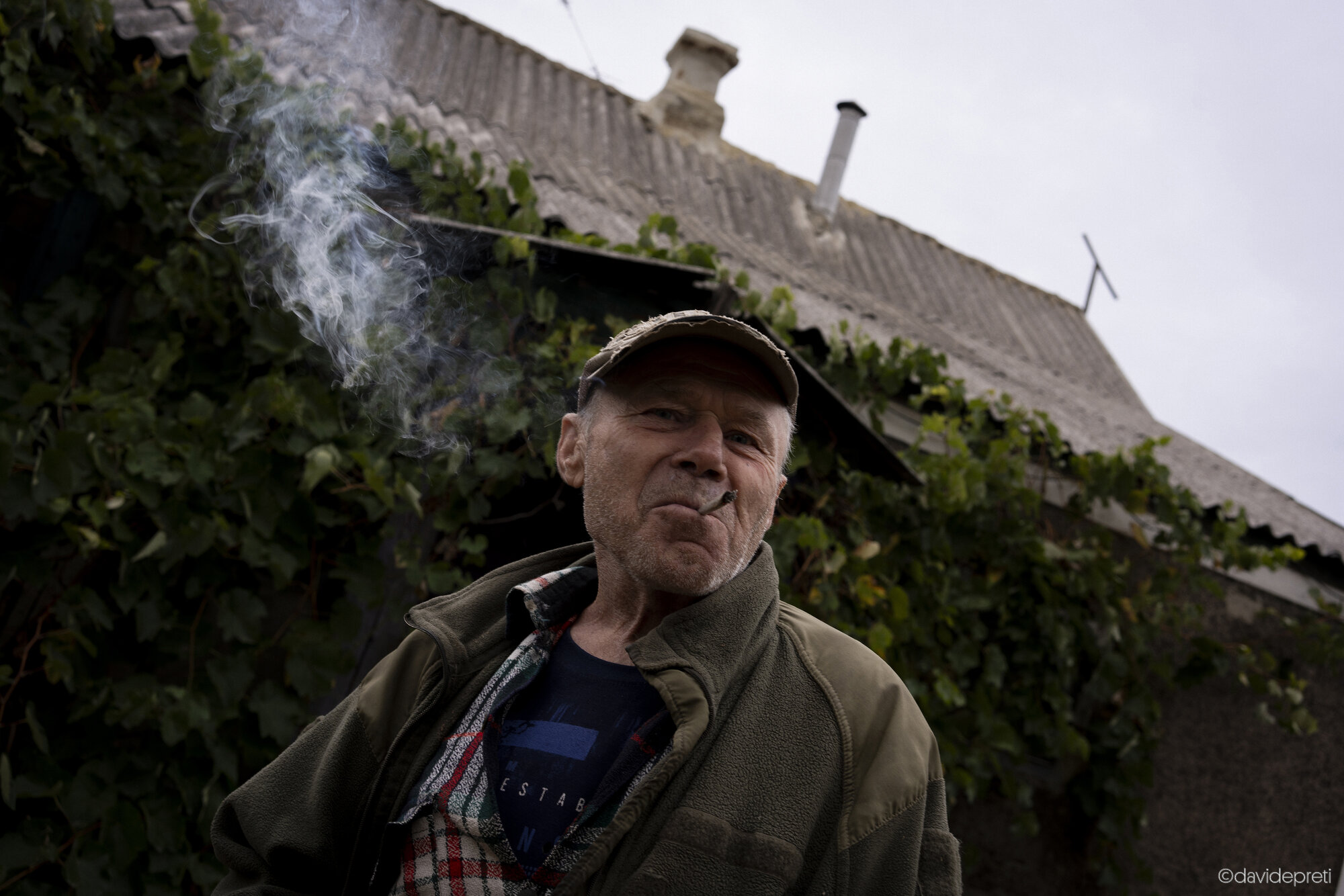 Maryevca, Ukraine — October 16, 2024.

VICTOR - 57 yo

"My husband has been disabled for twenty years. He had a severe accident while working in a workshop. When the weather is bad, like today, he suffers a lot: he can't move his arms, and he gets sad because he struggles even to eat or move. On days like this, I have to feed him myself, otherwise he won't eat. In the summer, though, he does a bit better.

This is my life—taking care of him. Now we are all alone. Our only daughter fled with her family to the Kharkiv region and hasn't returned yet. We haven't seen her for almost two years. We need someone like Natalia, someone to help us, because otherwise it's just the two of us facing all these hardships.

An old proverb says: 'If we stay alive, we won't die.' That's how we live, with the sole hope that peace will come soon."
